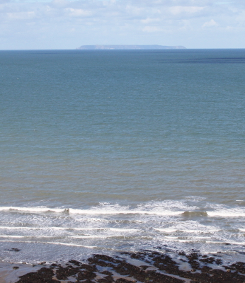 A distant view of Lundy from Peppercombe Beach